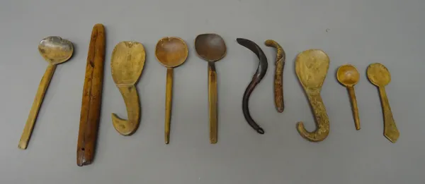 Treen wares; a collection of ethnic and other wooden spoons and a shaped stick, (31cm), (10).