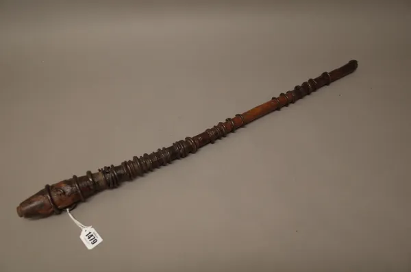 A Sudanese iron bound hardwood club, with bulbous head and pattern carved central grip, 80cm.