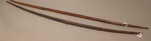 A hardwood and leather bound bow (141cm), possibly New Guinea and a bamboo bow (135cm), (2)