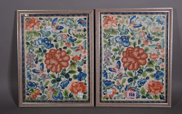 A pair of Chinese embroidered panels, circa 1900, worked with flowers and insects, 28cm x 20.5cm., framed and glazed.  CAB