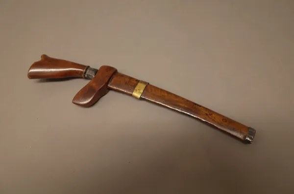 A Sumatran Bade Bade with single edged steel blade (18cm), wooden handle and sheath and a Burmese Dha, with plain ivory handle, silver mounts and a wo