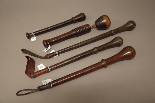 Four leather bound weighted coshes/whips and one further wood and leather cosh with ribbed shaft and separate bulbous head, the longest 50cm (5).