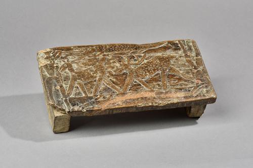 An early Norwegian carved wood panel, 18th century, carved in relief depicting 'The Legend of Sigur' with later applied legs converting the panel to a