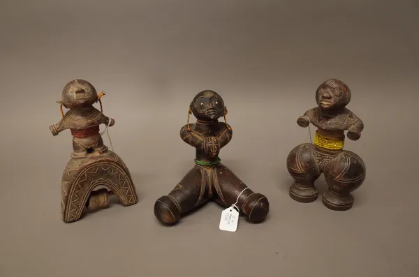 Three African fertility dolls, possibly Namji, each carved wood with beaded decoration, 20cm high, (3).