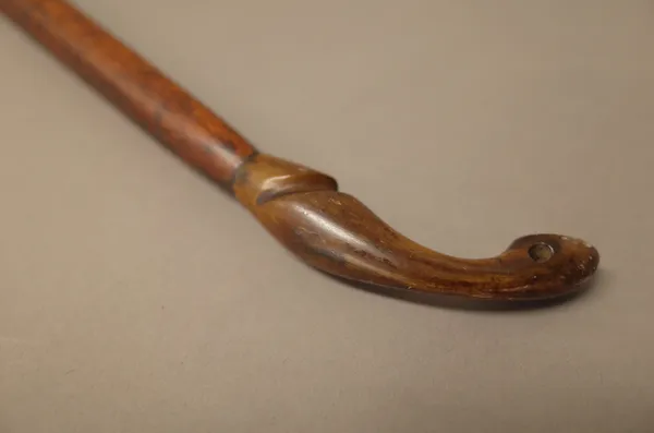 A yew wood longbow or selfbow, with cord grip and horn nocks, 188cm.  1858