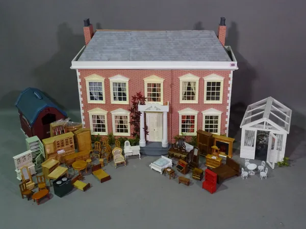 A 20th century Georgian style two storey dolls house with dolls, furniture, conservatory and a sperate barn, (qty).   BAY 1