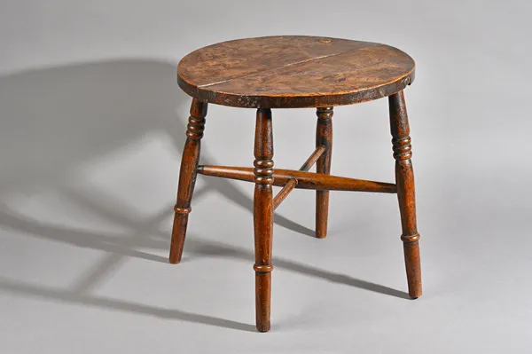 A 19th century elm circular stool on turned beech supports, 46cm deep x 45cm high. Illustrated