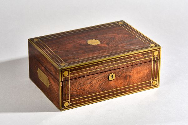 A 19th century French brass mounted rosewood toilet box with fitted interior, 33cm wide x 14cm high.    Illustrated £10  406