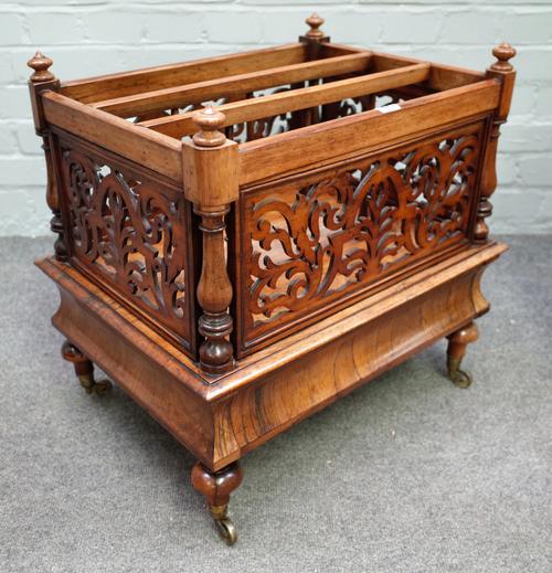 A late Regency rosewood three division Canterbury with fret cut sides and single drawer base, 54cm wide x 53cm high.