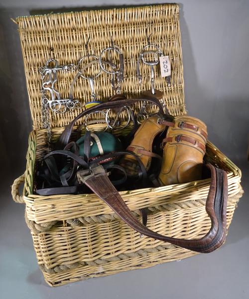Polo interest; a large box of tack and saddles, (qty).  C8