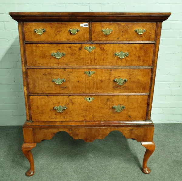 A George I figured walnut chest of two short and three long graduated drawers on later stand, 100cm wide x 123cm high.