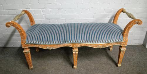 A late 18th century North Italian style polychrome painted window seat, on six tapering square supports, 146cm wide x 70cm high.
