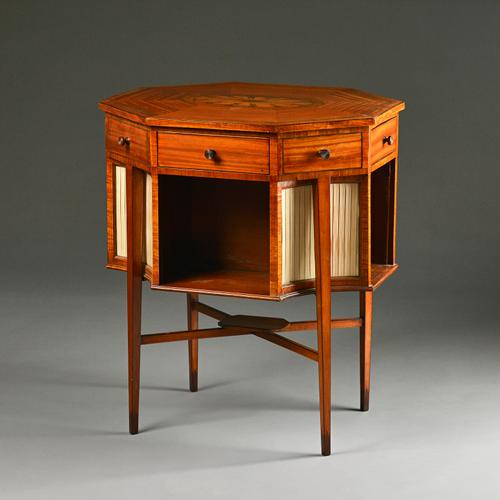 A George III inlaid satinwood work/centre table of compressed octagonal form, on tapering square supports, 63cm wide x 73cm high. Illustrated