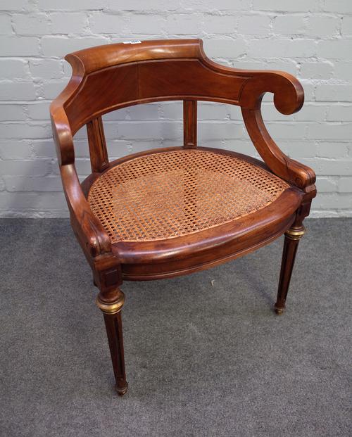 A 19th century French gilt metal mounted walnut tub back office chair on tapering fluted supports, 64cm wide x 77cm high.