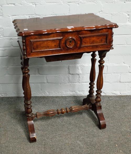 A 19th century French walnut work table with shaped lift top on baluster supports, 54cm wide x 69cm high