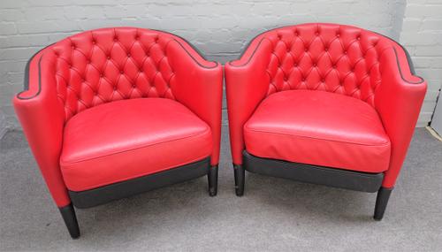 MOROSO; a pair of 20th century red and black leather upholstered tub back Rich Capitoné armchairs, 83cm wide x 72cm high (2).