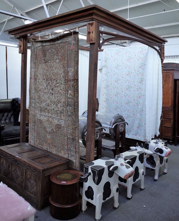 A William IV mahogany four poster bed with lappet carved columns, 215cm wide x 235cm deep.