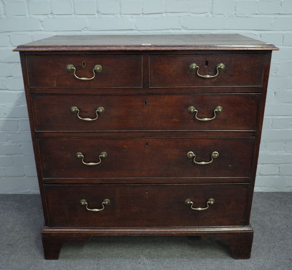 A mid-18th century oak chest of two short and three long graduated drawers, 95cm wide x 97cm high.