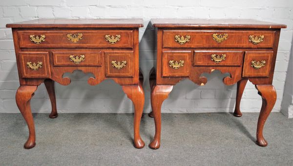 A pair of crossbanded figured walnut four drawer lowboys in the mid-18th century style, on pad feet, 71cm wide x 74cm high (2).