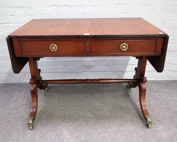 A late George III mahogany two drawer sofa table, on four downswept supports, 98cm wide x 72cm high.