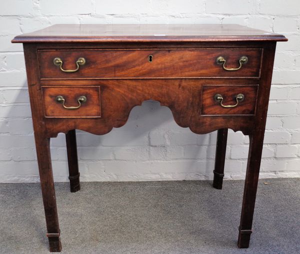 A mid-18th century mahogany lowboy with one long and two short drawers on canted square supports, 79cm wide x 79cm high.