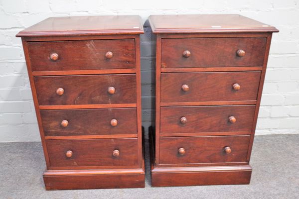 A pair of hardwood bedside tables, of four long graduated drawers on plinth base, 46cm wide x 76cm high (2).