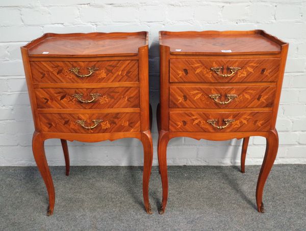 A pair of Louis XV style floral marquetry inlaid kingwood serpentine three drawer petit commodes, on cabriole supports, 44cm wide x 72cm high, (2).