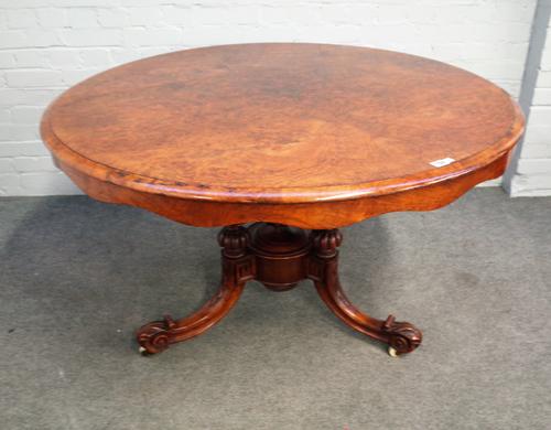 A Victorian figured walnut circular snap top centre table on carved tripod base, 121cm diameter x 73cm high.