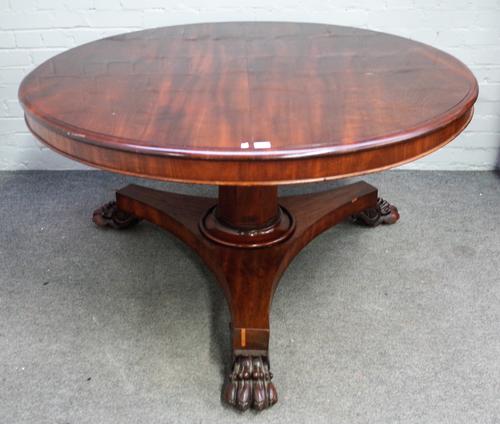 A William IV mahogany circular snap top breakfast table, on lion's paw feet, 133cm diameter x 73cm high.