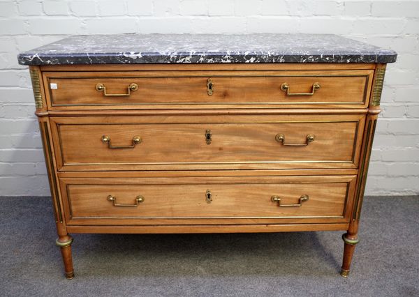 A 19th century French commode, the marble top over a gilt metal mounted mahogany base of three long drawers on turned supports, 114cm wide x 84cm high