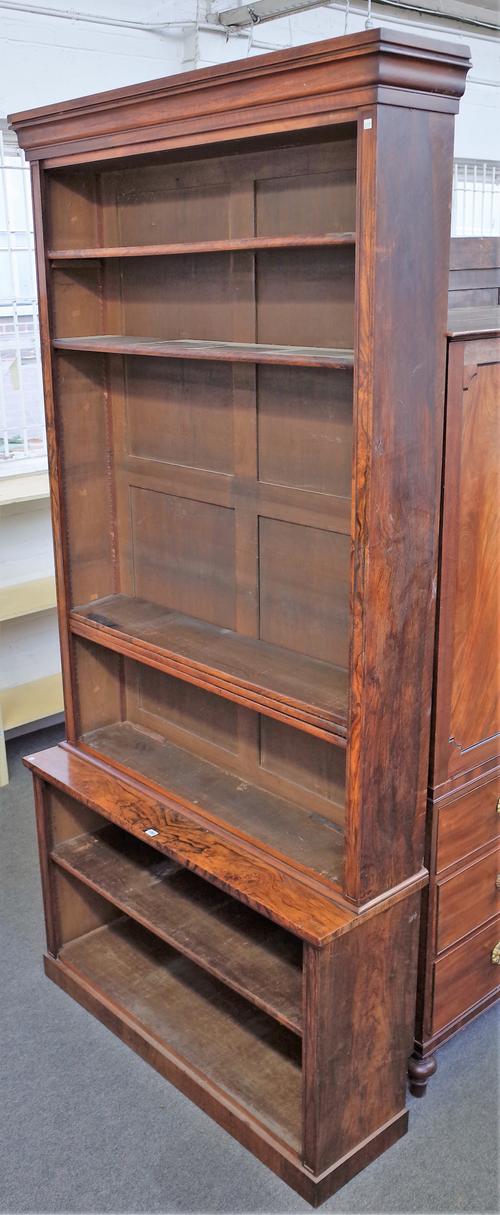 A Victorian figured walnut double height open bookcase, 130cm wide x 262cm high.