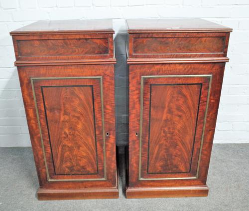 A pair of early 19th century mahogany pedestals each with single drawer over cupboard, 48cm wide x 99cm high (2).