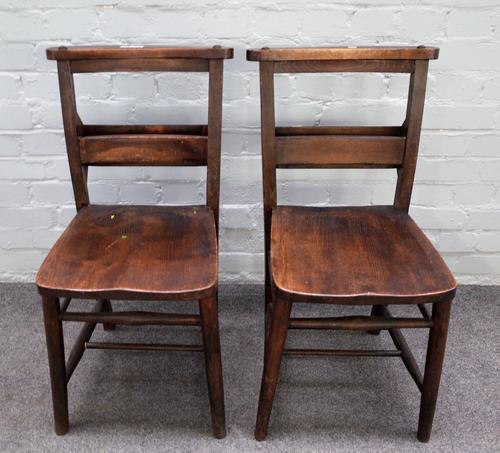 Mealing Bros Ltd; a set of eight early 20th century stained beech and elm chapel chairs, on turned supports, 35cm wide x 76cm high, (8).