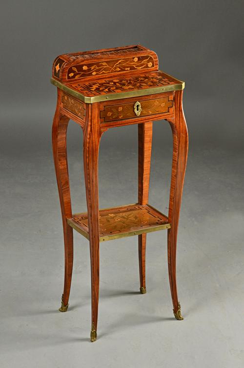 A 19th century French marquetry inlaid kingwood lady's writing desk, with tambour superstructure over frieze drawer on cabriole supports, united by un
