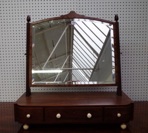 A large Regency inlaid mahogany toilet mirror with bow three drawer base, 74cm wide x 74cm high.