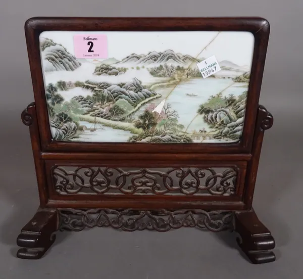 A 19th century Asian porcelain plaque in a hardwood stand, 24cm, (a.f.).  CAB