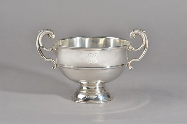 A silver twin handled trophy bowl, raised on a circular foot, diameter 16.5cm, London 1905, weight 477 gms. Illustrated