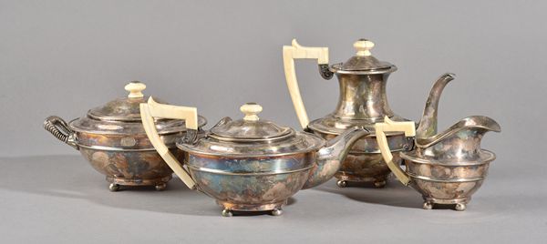 A French four piece tea set, comprising, a teapot, a coffee pot, a twin handled sugar bowl and cover and a milk jug, each piece of compressed circular