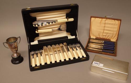 A silver rectangular table cigarette box, wooden lined within, the hinged lid presentation inscribed, by Mappin & Webb, London, 1961, a silver twin ha