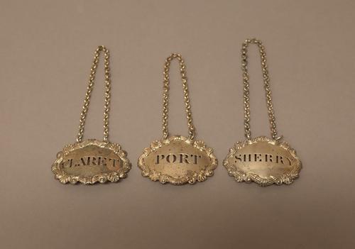 A silver decanter label, detailed CLARET, probably London 1814, an Irish silver decanter label detailed PORT, Dublin (the date letter lacking, but mar