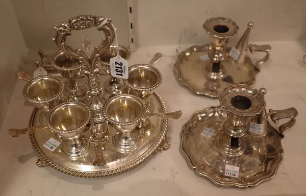 Plated wares, comprising; a six cup egg cruet stand, with a loop shpaed handle, the six egg cups and the stand decorated with gadrooned rims, with six