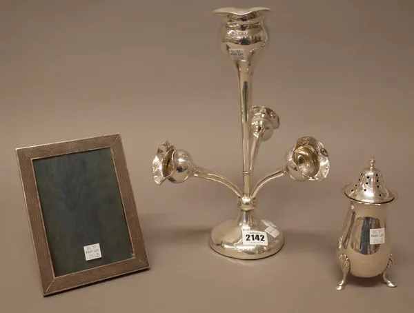 Silver and silver mounted wares, comprising; a table centrepiece formed as a principal vase, surrounded by three smaller vases, on a loaded circular b