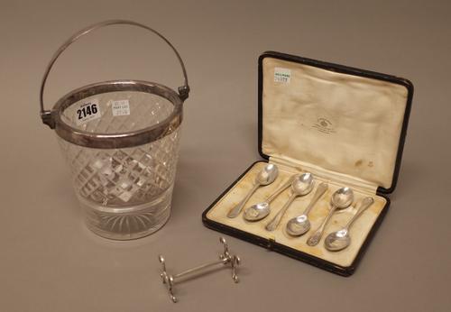 Silver and silver mounted wares, comprising; a faceted glass ice bucket, with diamond cut decoration, the mount with a swingover handle, with a pierce