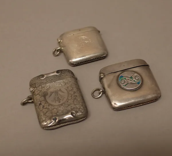 A Victorian silver vesta case, with foliate engraved decoration, Birmingham 1896, a silver vesta case, with traces of blue enamelled decoration, Birmi