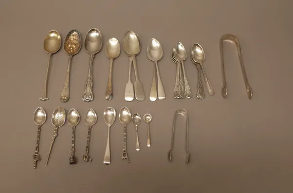 Silver flatware, comprising; two pairs of sugar tongs, three condiment spoons, four matching teaspoons, ten further silver spoons and four South Ameri