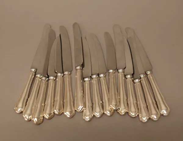 A set of eight table knives, having steel blades and with loaded silver handles and a set of eight cheese knives, having steel blades and with loaded