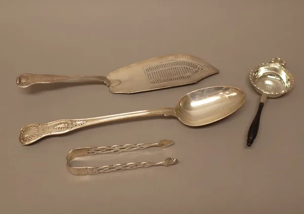 Silver, comprising; a King's pattern double struck stuffing spoon, the hallmark rubbed, a George III King's pattern double struck fish slice, London 1