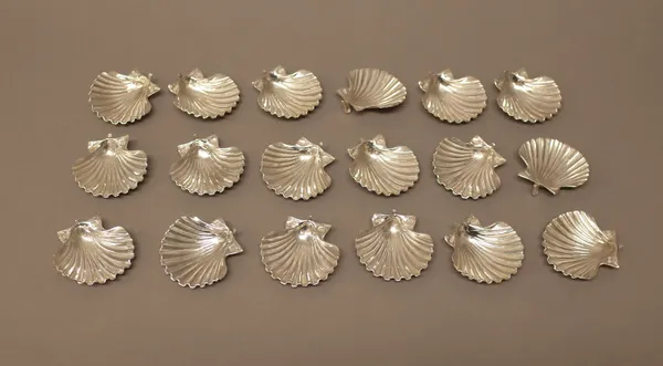 Eighteen small dishes modelled as scallop shells, each fitted with a hook, some indistinctly marked 900, possibly Greek, width 5cm, combined weight 28