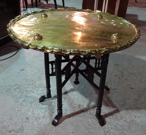 A large brass circular tray top table with associated folding base, (2).  I5   1332, 4845,