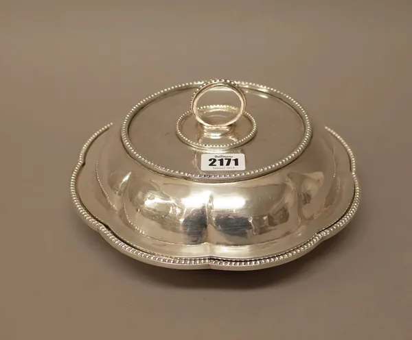 An Egyptian shaped circular lidded entree dish, of lobed form, decorated with a beaded rim and with a detachable handle, weight 1215 gms.